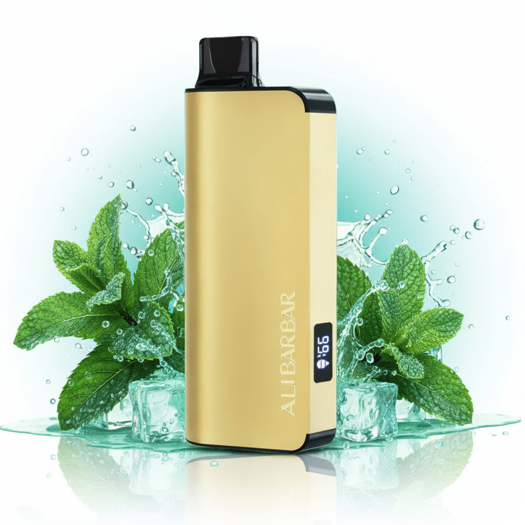 Gold vape device with digital display, mint leaves, and ice splashes in background