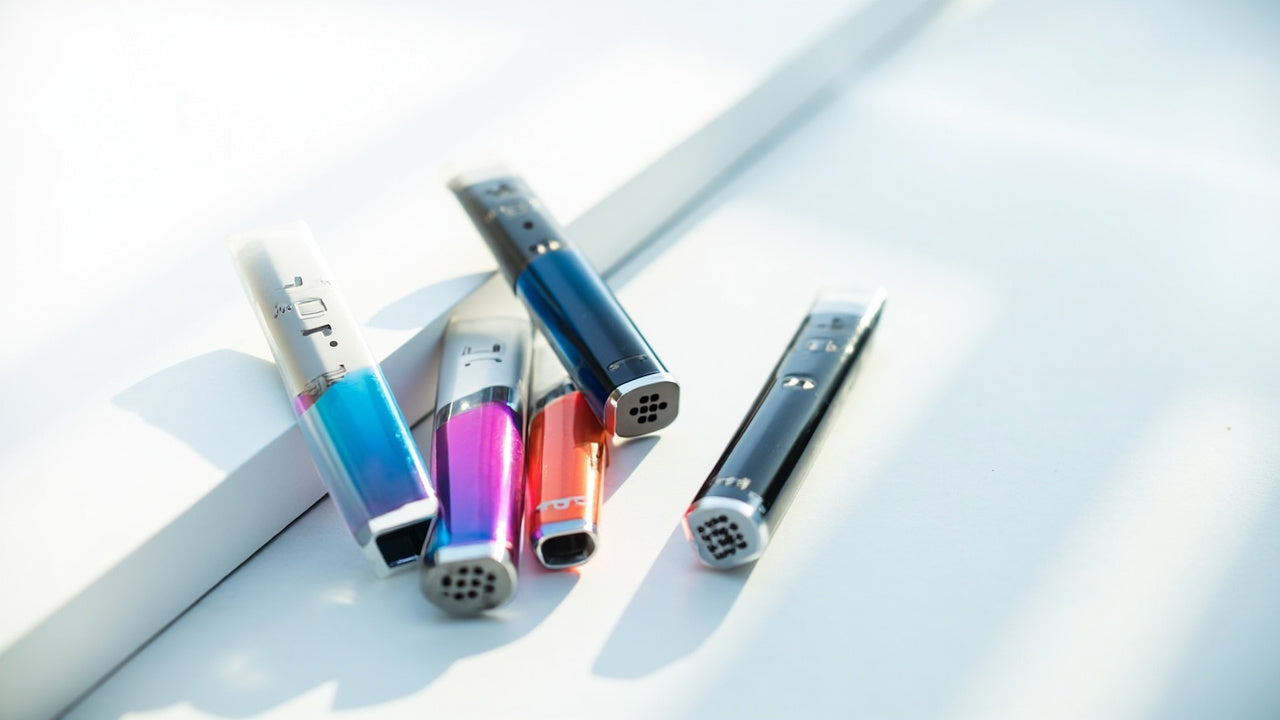 colorful disposable vapes on a white surface with soft daylight and modern feel