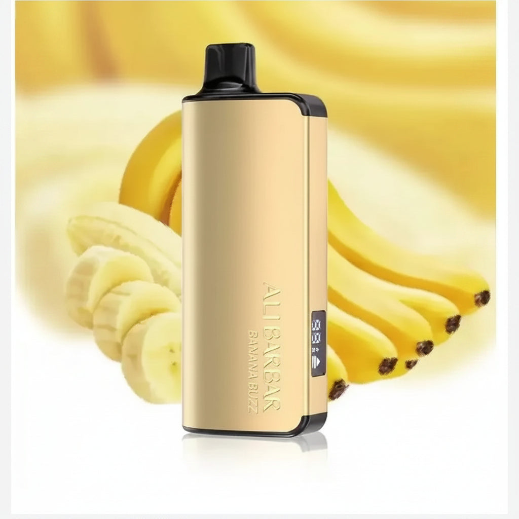 Gold Banana Buzz vape device in front of fresh bananas, Alibarbarvaping.com